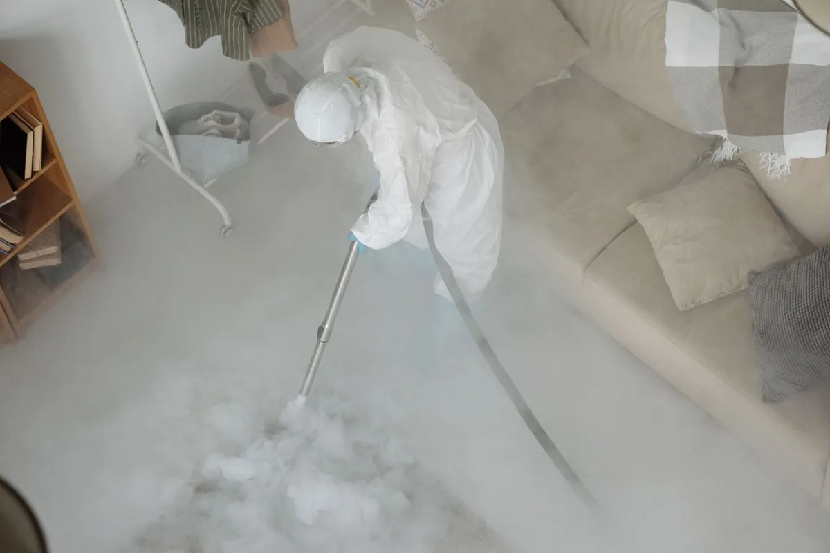 Biohazard cleanup technician in protective equipment, Atlanta, GA